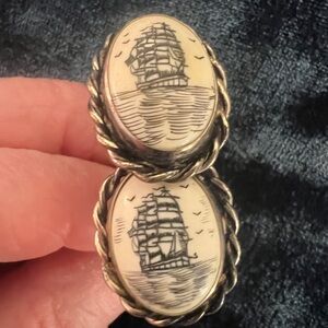Vintage scrimshaw type cufflinks with tie tac.  Silver surround